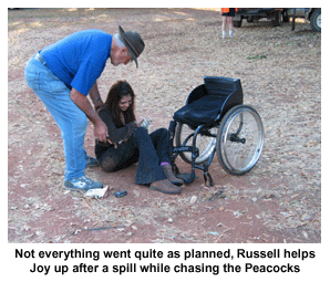 Not everything went quite as planned, Russell helps Joy up after a spill while chasing the Peacocks